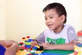 AsianÃ¢â¬â¹ childÃ¢â¬â¹ boyÃ¢â¬â¹ playingÃ¢â¬â¹ withÃ¢â¬â¹ theÃ¢â¬â¹ plasticÃ¢â¬â¹ blockÃ¢â¬â¹ toys.Ã¢â¬â¹